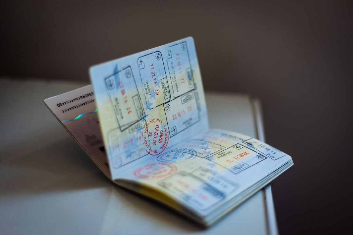Open passport showing multiple visa and entry stamps